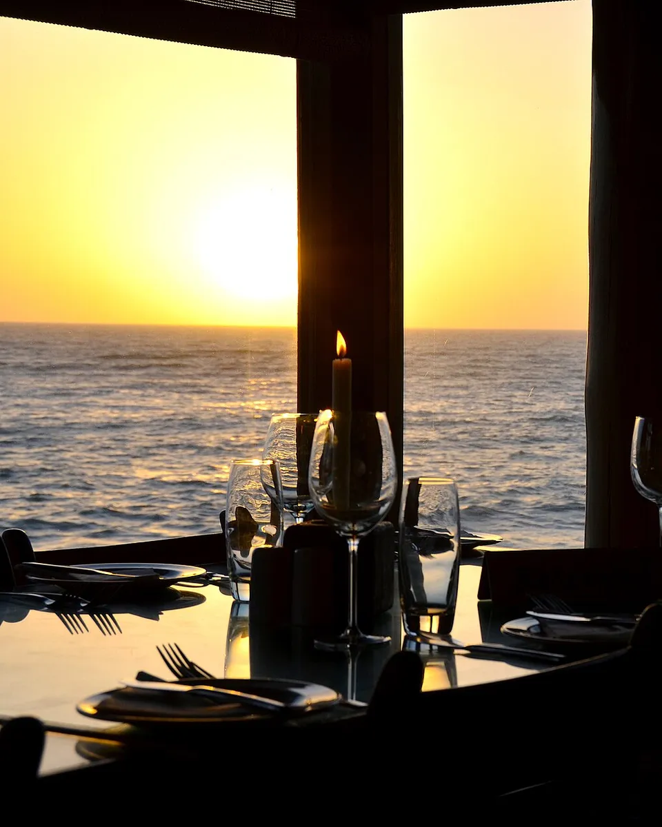 Cold drinks on a table in the warm glow of a Namibian sunset